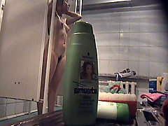 Joyful young puss with bushy pubis takes a shower voyeur video #3