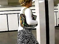 This sexy MILF seems to have no panties under her skirt. Let's check it up voyeur video #4