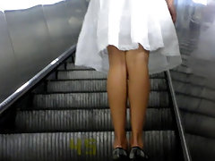 Beauty in a wide white skirt. Beautiful round ass and shaved crotch in a yellow thong. Excellent pussy close up shots. Great upskirt voyeur video #1